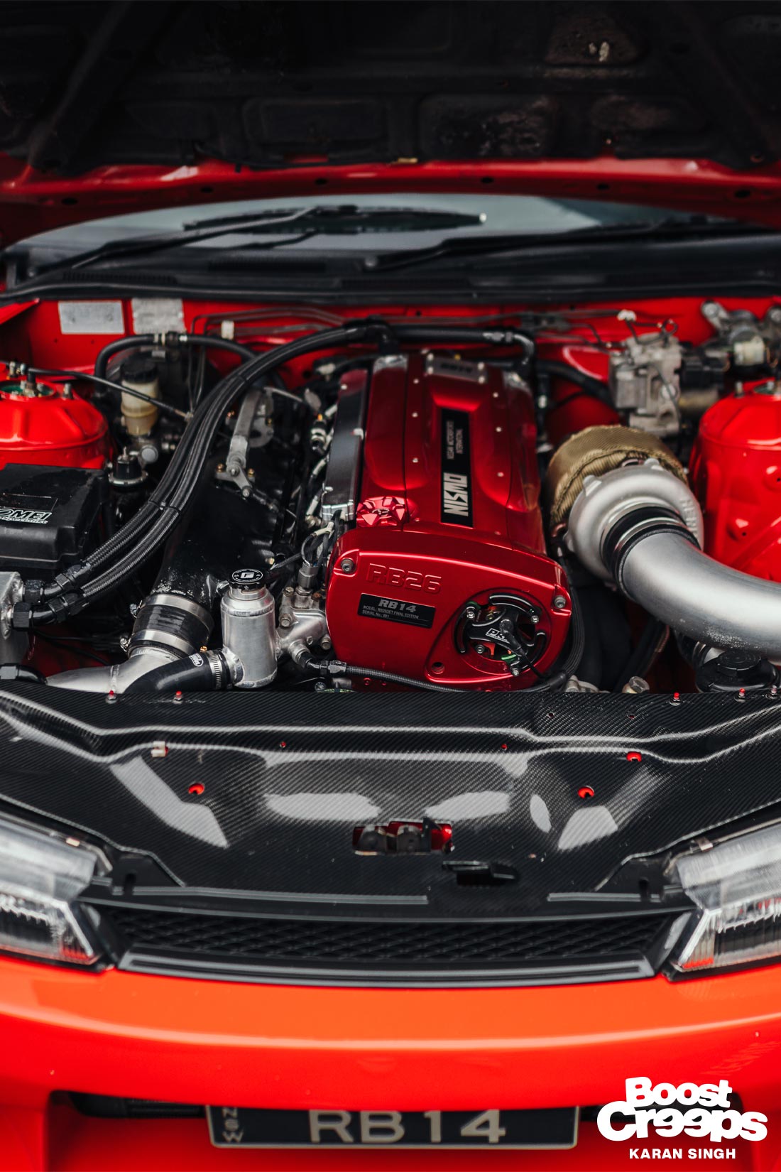 RB26 engine bay of red Nissan 200sx S14