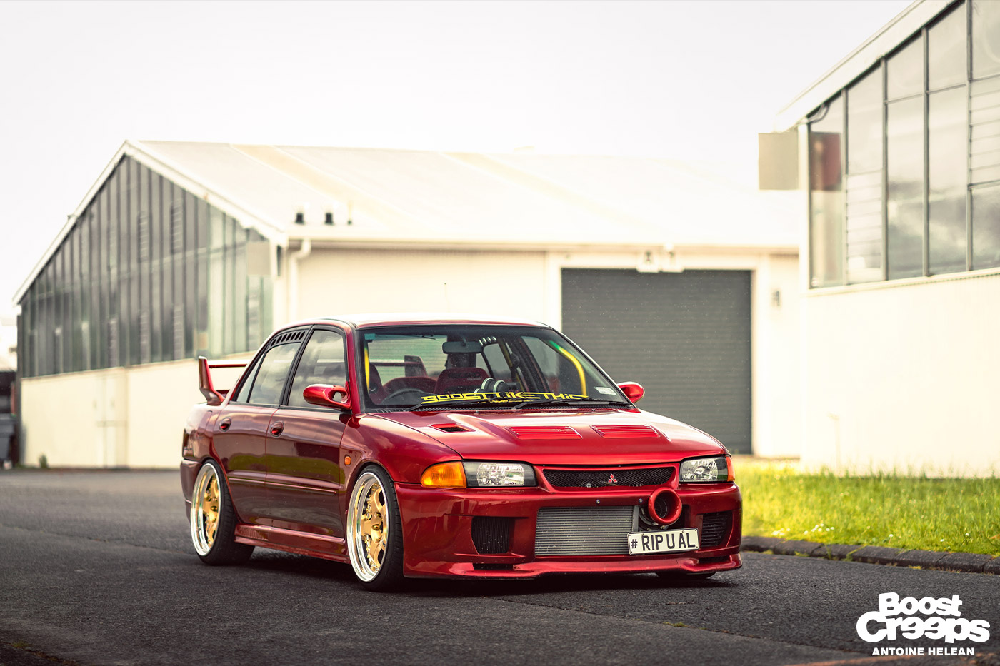 A Lancer Evolution 3 painted in candy apple red (in New Zealand)